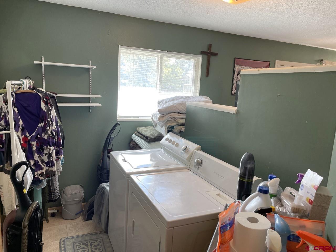 1201 Frontier Road Delta, CO 81416 - Photo 10 of 21 a utility room with dryer and washer