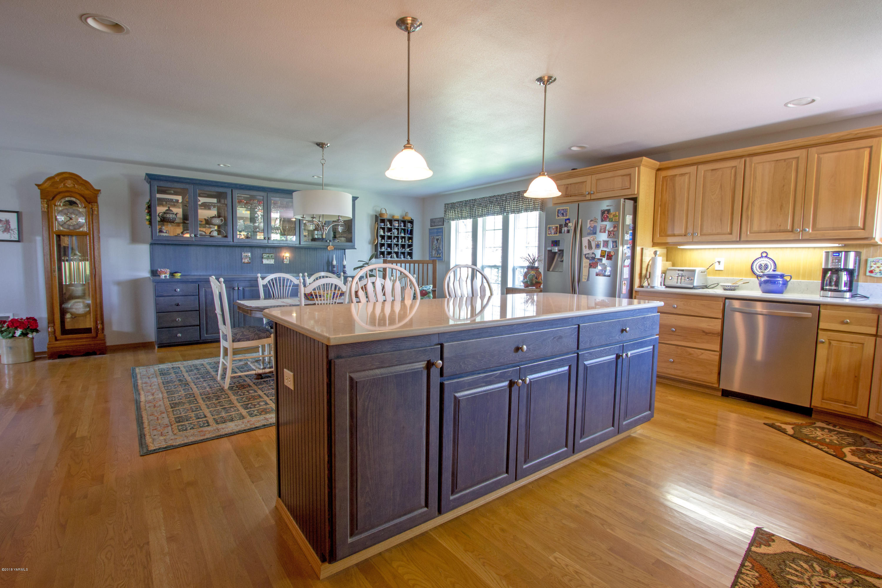 3210 Harrah Road Harrah, WA 98933 - Photo 16 of 33 a kitchen with a sink cabinets and wooden floor