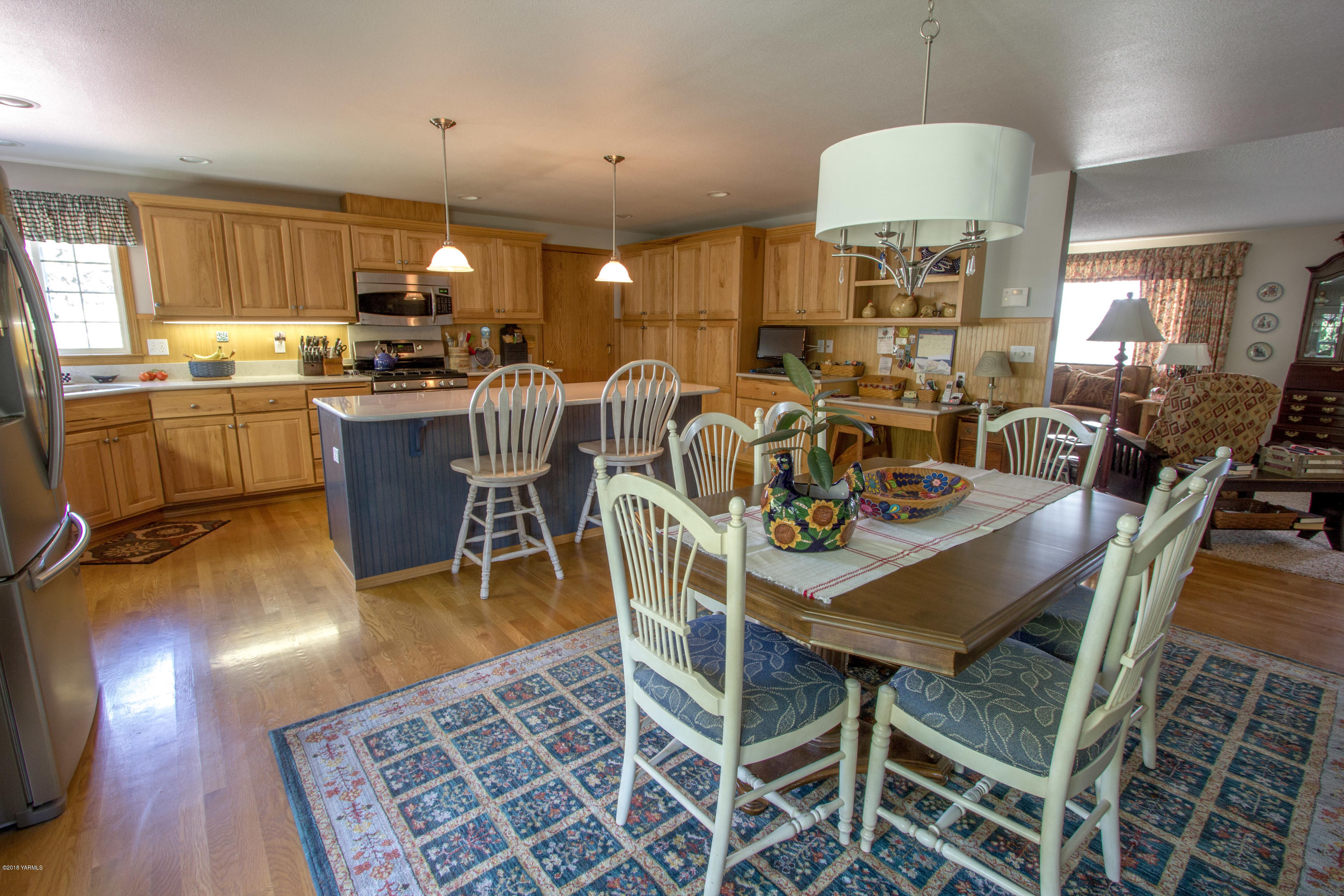 3210 Harrah Road Harrah, WA 98933 - Photo 18 of 33 a view of a dining room with furniture window and wooden floor