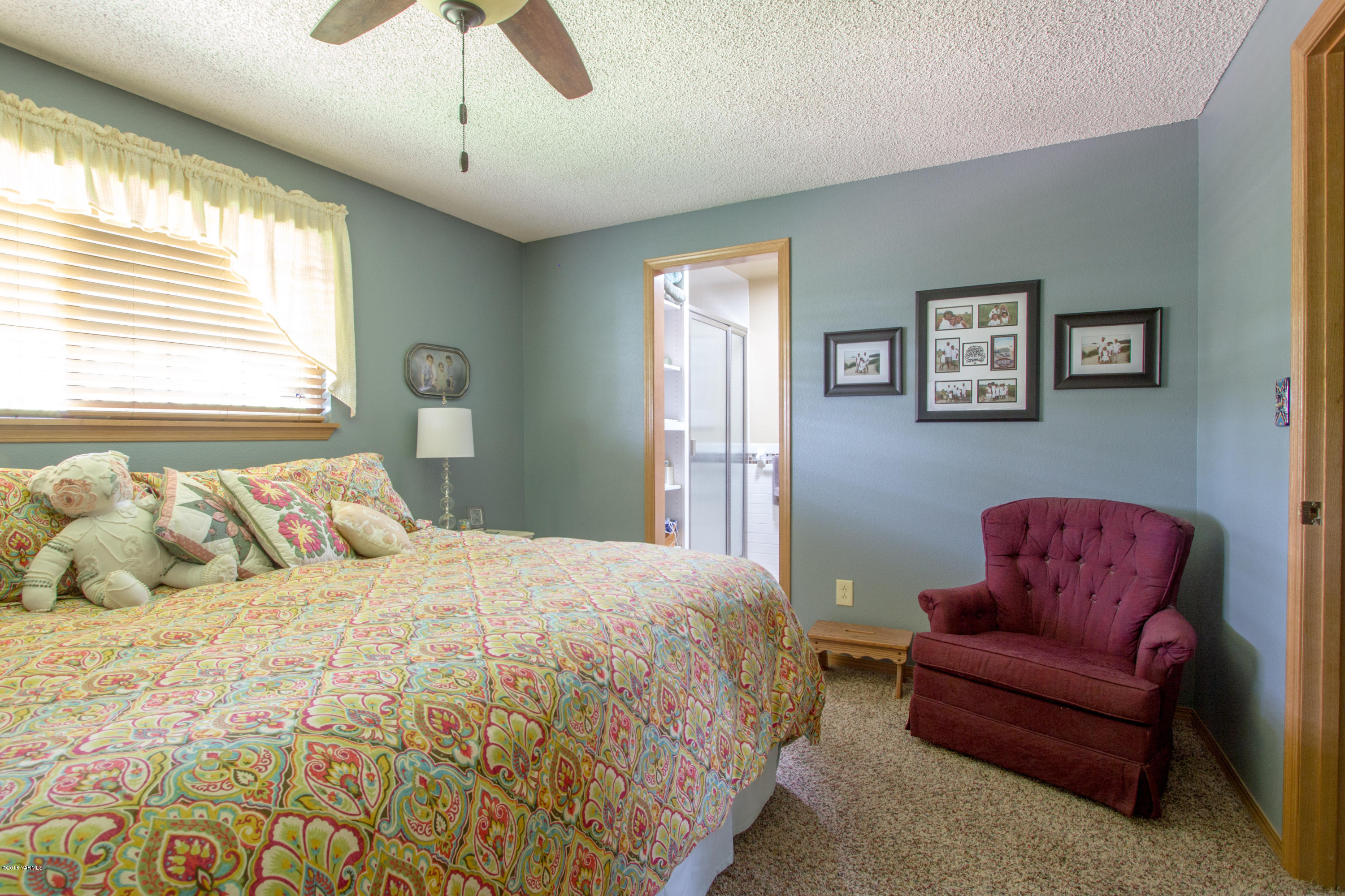 3210 Harrah Road Harrah, WA 98933 - Photo 20 of 33 a bedroom with a bed couch and window
