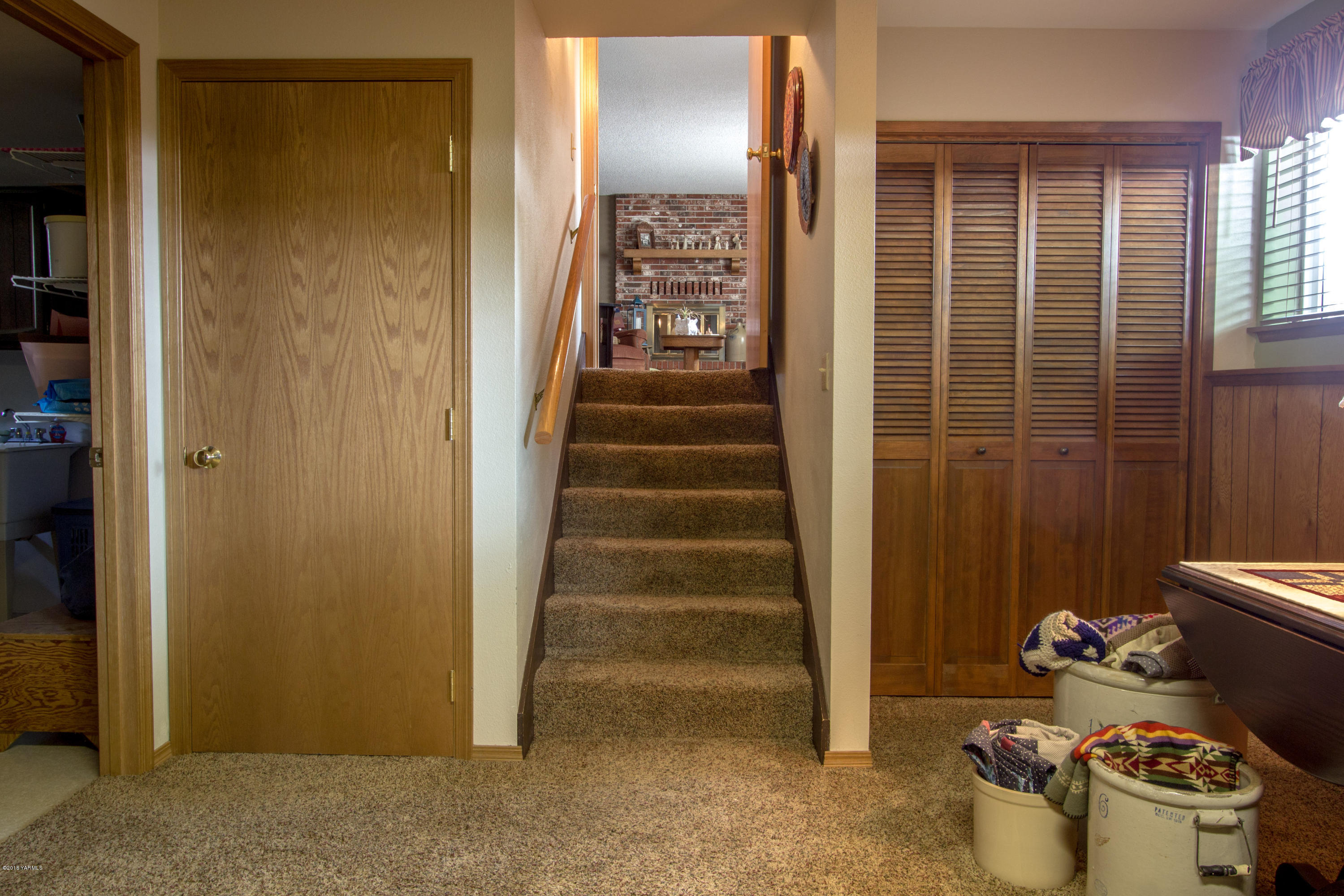 3210 Harrah Road Harrah, WA 98933 - Photo 28 of 33 a view of a hallway with front door and wooden floor
