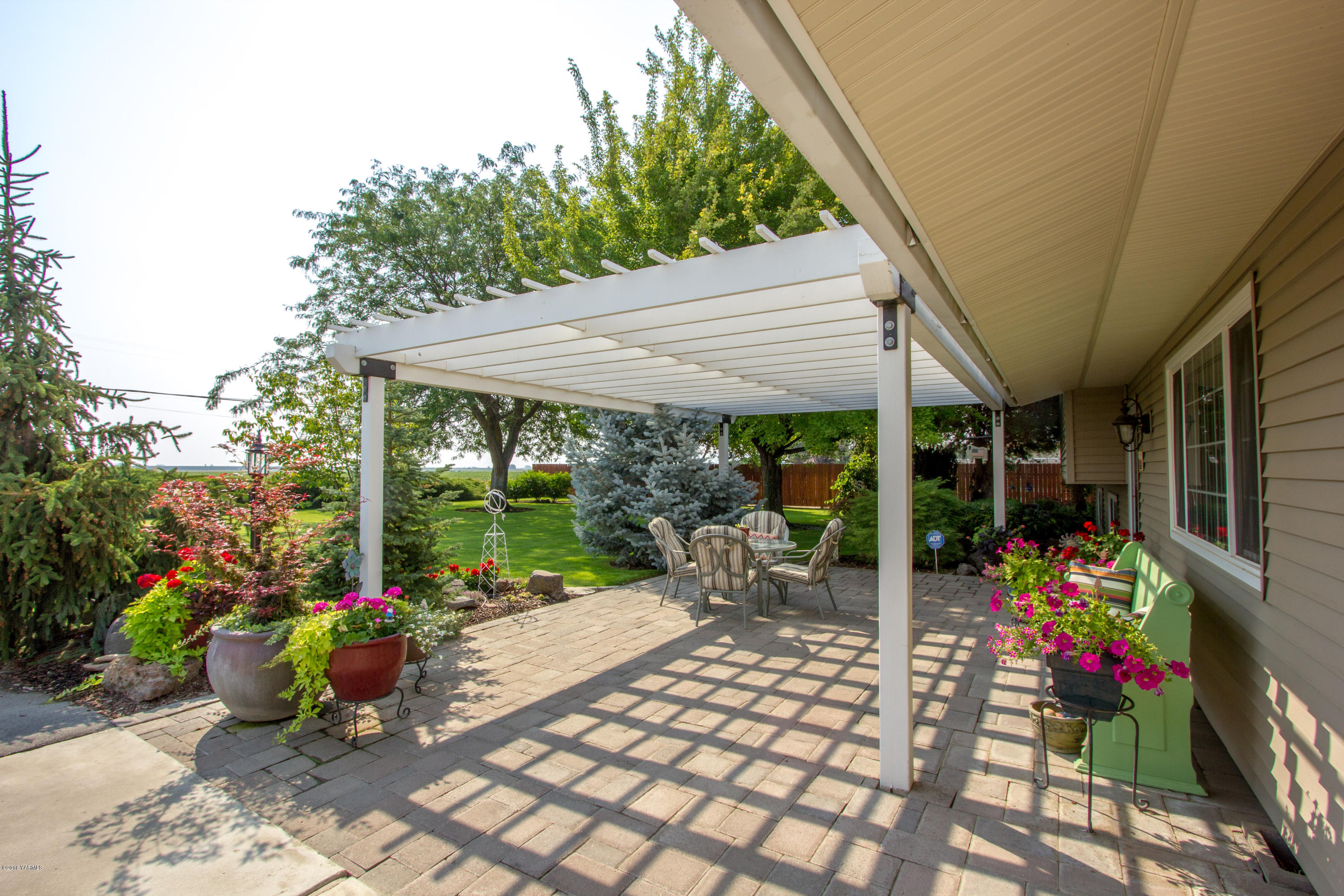 3210 Harrah Road Harrah, WA 98933 - Photo 6 of 33 a view of a patio with table and chairs potted plants