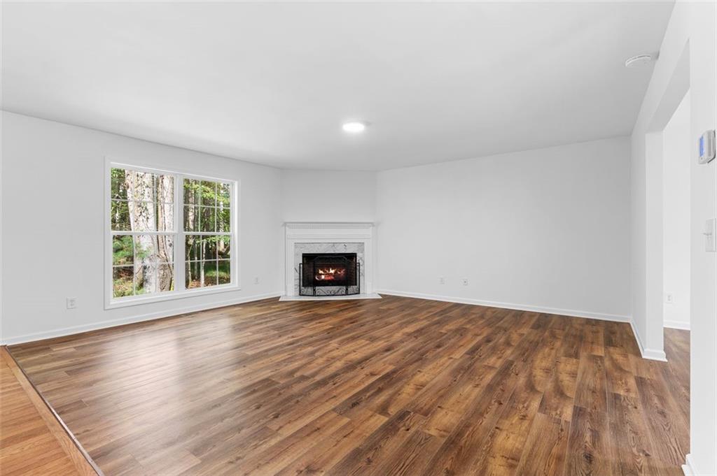 80 Castle Court Ellijay, GA 30540 - Photo 13 of 39 a view of an empty room with wooden floor and a window