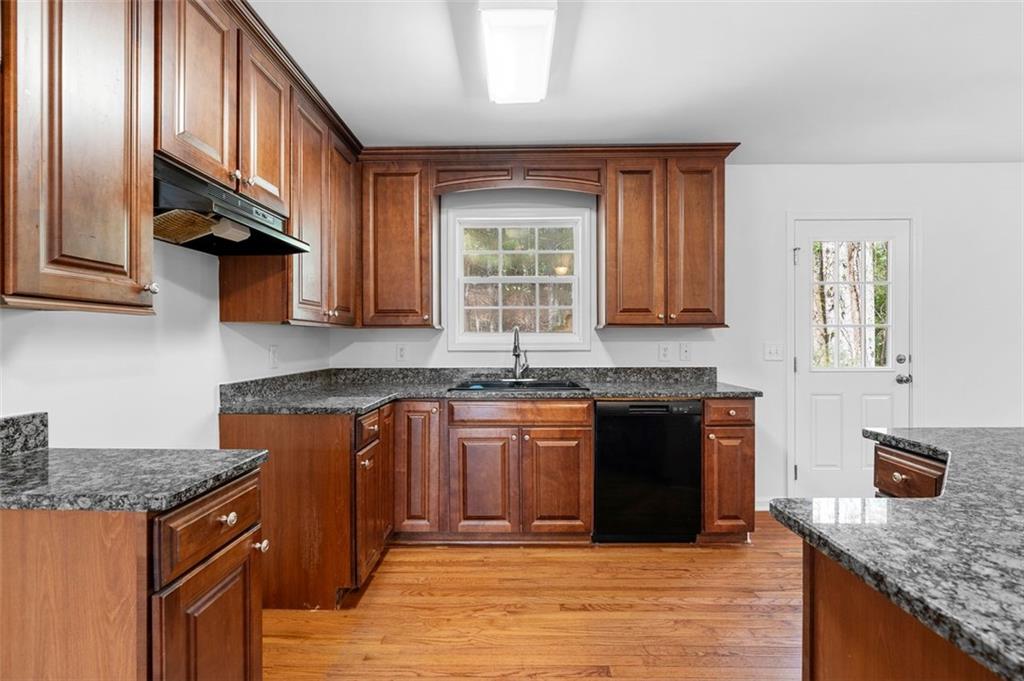 80 Castle Court Ellijay, GA 30540 - Photo 14 of 37 a kitchen with stainless steel appliances granite countertop a stove sink and cabinets