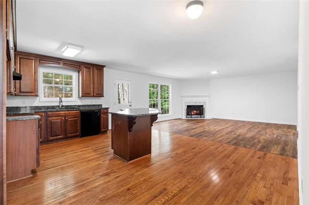 80 Castle Court Ellijay, GA 30540 - Photo 17 of 39 a kitchen with a sink cabinets and wooden floor