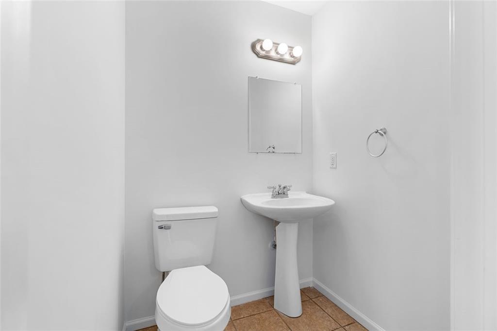 80 Castle Court Ellijay, GA 30540 - Photo 19 of 39 a bathroom with a sink toilet and a mirror