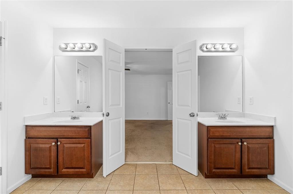 80 Castle Court Ellijay, GA 30540 - Photo 23 of 37 a spacious bathroom with a sink and a mirror