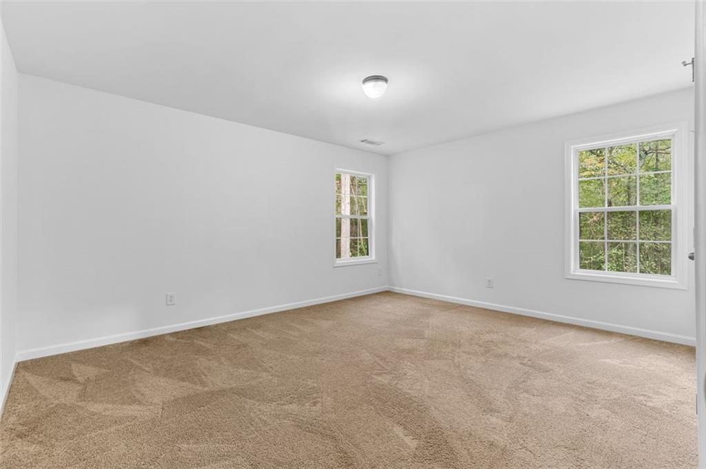 80 Castle Court Ellijay, GA 30540 - Photo 26 of 37 an empty room with windows