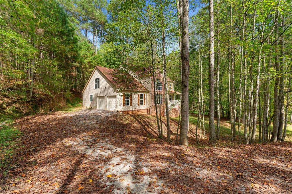 80 Castle Court Ellijay, GA 30540 - Photo 33 of 39 a view of a house with a yard and large trees