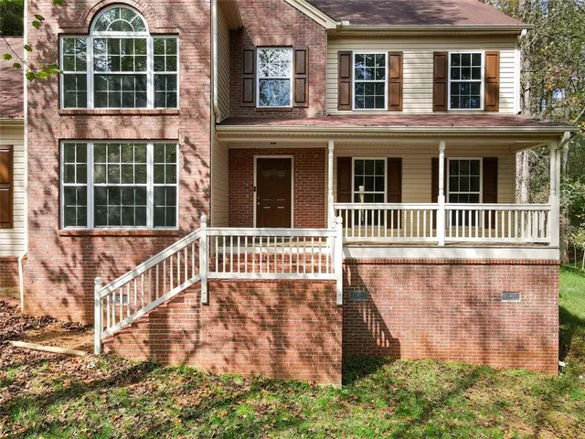 front view of a house with a fence