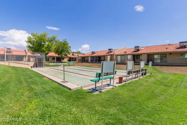 a view of a house with a backyard porch and sitting area