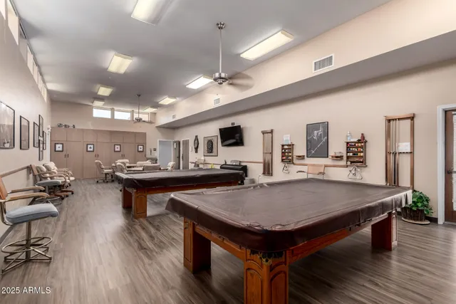 a room with furniture and pool table