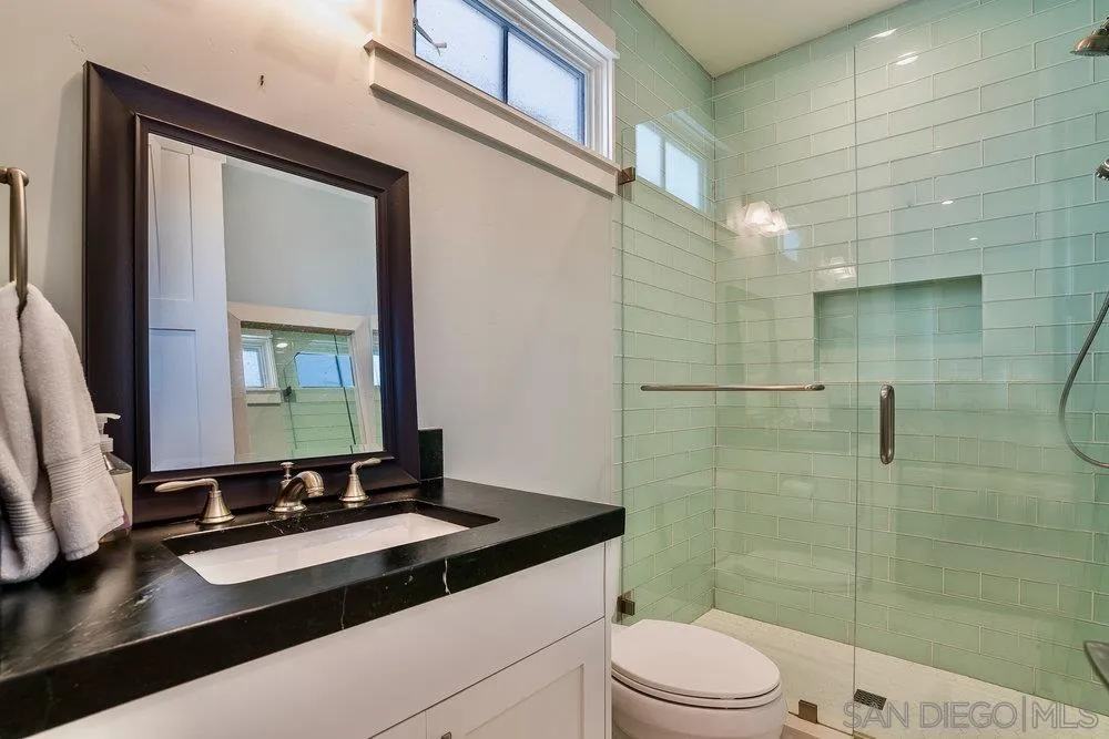 5769 Waverly Avenue La Jolla, CA 92037 - Photo 14 of 30 a bathroom with a sink a toilet and shower