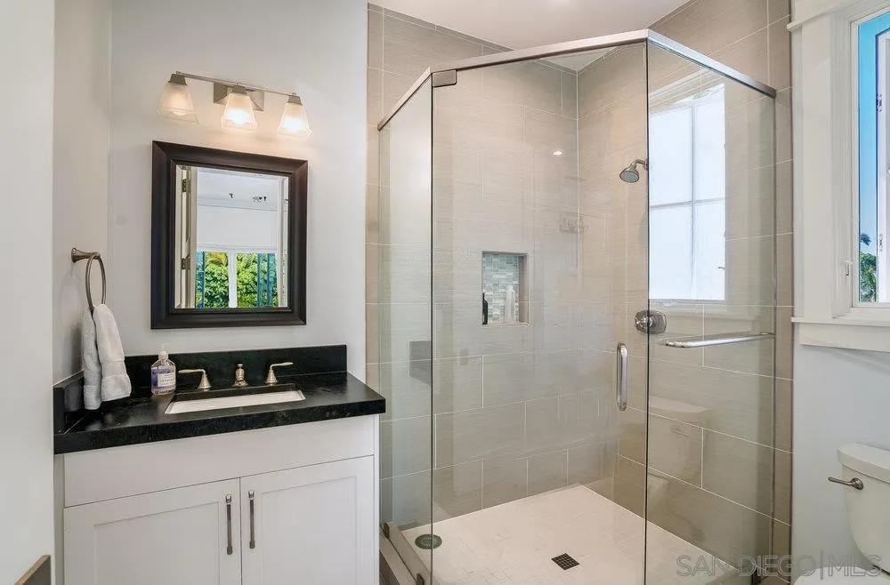5769 Waverly Avenue La Jolla, CA 92037 - Photo 20 of 30 a bathroom with a sink and a mirror