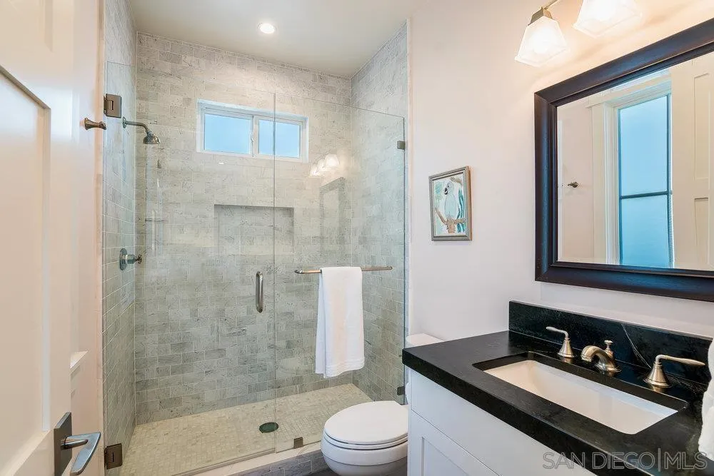 5769 Waverly Avenue La Jolla, CA 92037 - Photo 22 of 30 a bathroom with a sink a toilet and shower