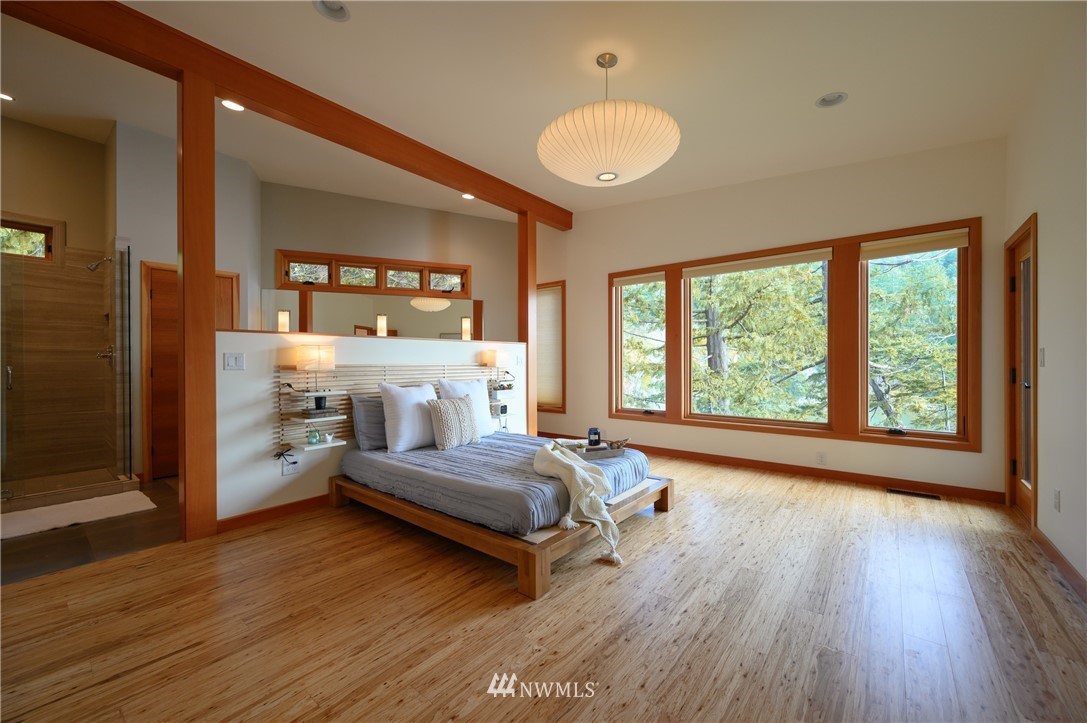 340 Cove Road Bellingham, WA 98229 - Photo 16 of 40 a bedroom with a bed and a large window