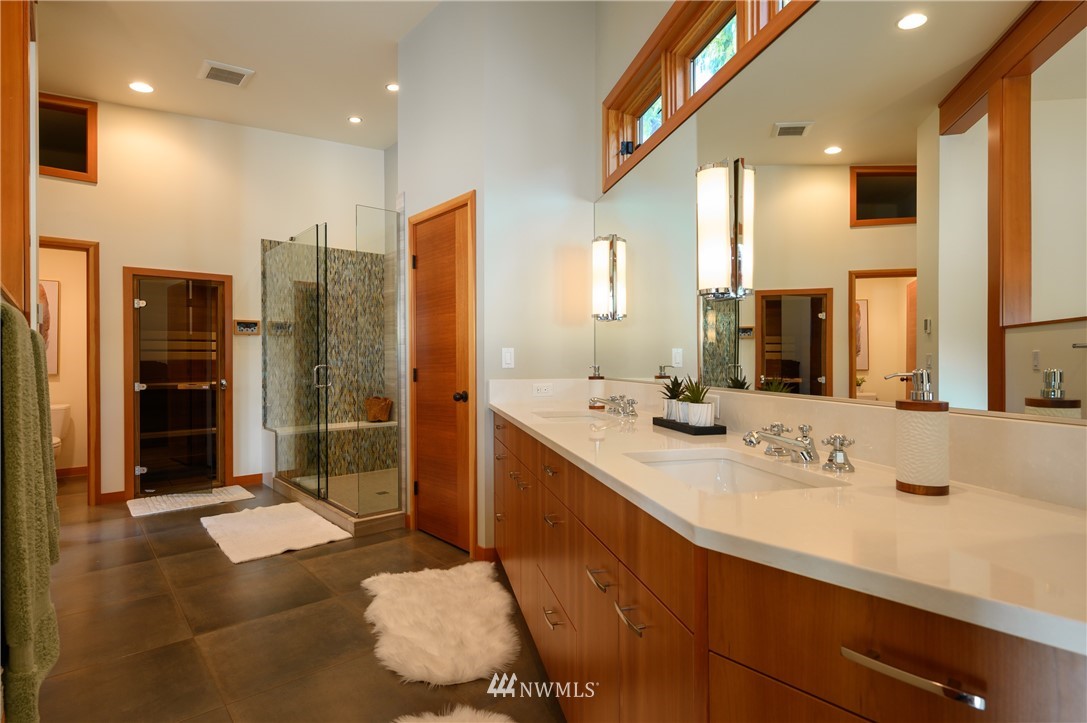 340 Cove Road Bellingham, WA 98229 - Photo 18 of 40 a bathroom with double vanity and a shower