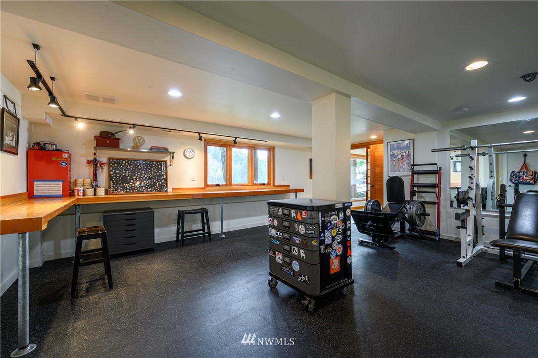 340 Cove Road Bellingham, WA 98229 - Photo 26 of 40 a living room with furniture a window and gym equipment