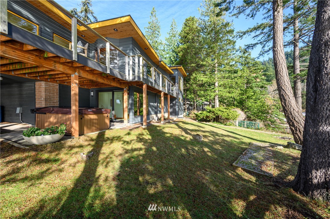 340 Cove Road Bellingham, WA 98229 - Photo 5 of 40 a view of a house with a tree in front