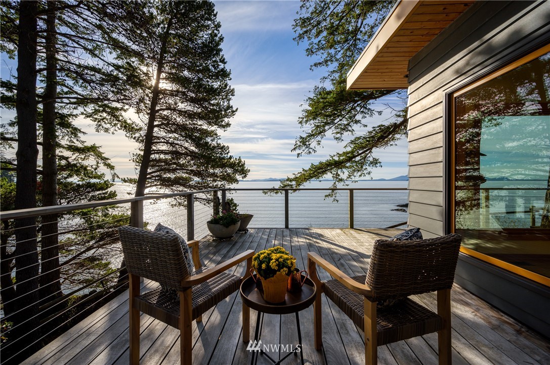 340 Cove Road Bellingham, WA 98229 - Photo 9 of 40 a roof deck with table and chairs and wooden floor