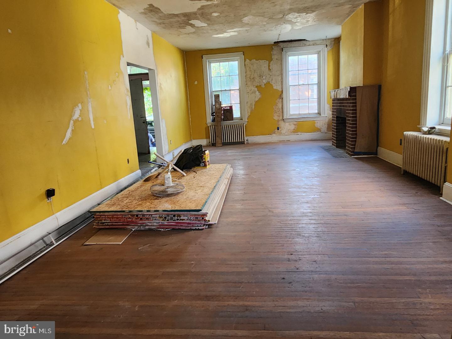 91 West Broadway Salem, NJ 08079 - Photo 5 of 20 a room with wooden floor and furniture