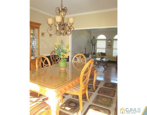 5 Old Ridge Road Monmouth Junction, NJ 08852 - Photo 11 of 24 a view of a dining room with furniture and a chandelier