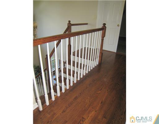 5 Old Ridge Road Monmouth Junction, NJ 08852 - Photo 12 of 24 a view of a hallway with wooden floor