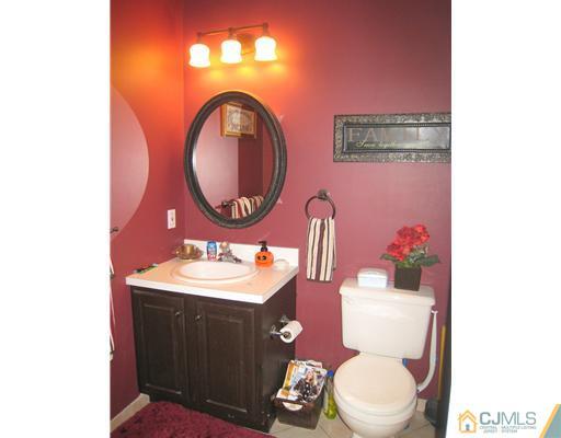 5 Old Ridge Road Monmouth Junction, NJ 08852 - Photo 21 of 24 a bathroom with a toilet a sink and a mirror