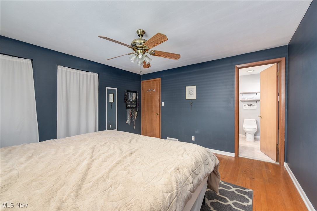 13765 Newton Road Cleveland, OH 44130 - Photo 27 of 42 Bedroom featuring wood finished floors, ceiling fan, and connected bathroom