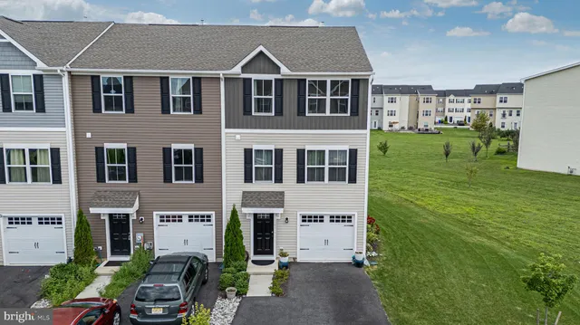 a aerial view of a house with a yard