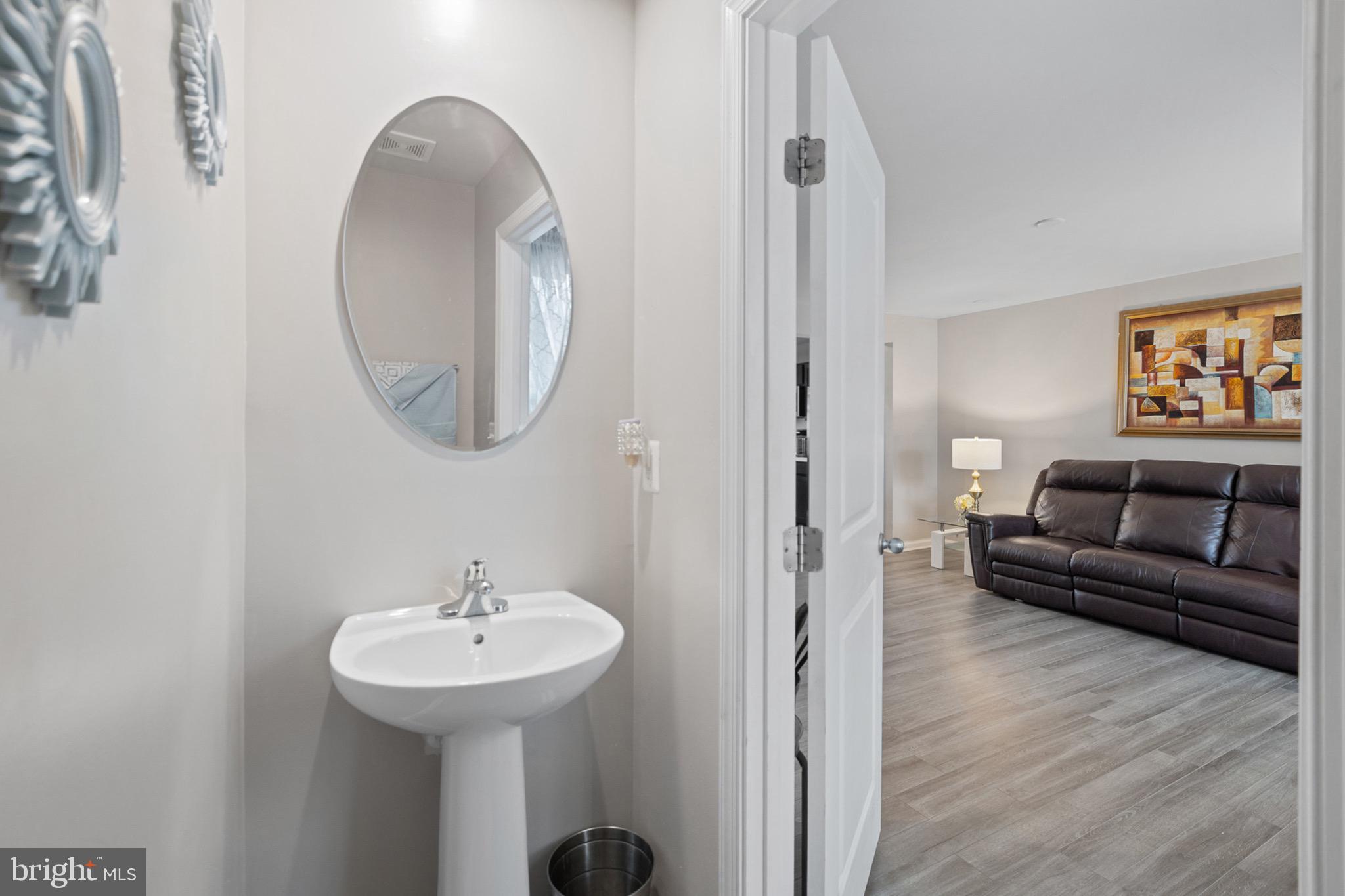 1049 Wickersham Way Middletown, DE 19709 - Photo 11 of 33 a bathroom with a sink and a mirror