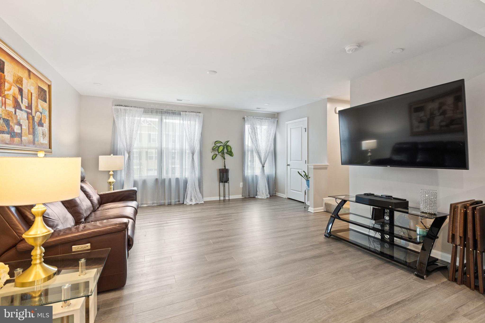 1049 Wickersham Way Middletown, DE 19709 - Photo 13 of 33 a living room with furniture and a flat screen tv