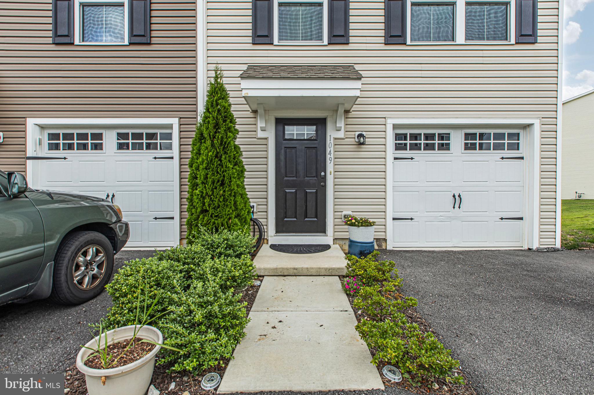 1049 Wickersham Way Middletown, DE 19709 - Photo 4 of 33 a front view of a house with a yard