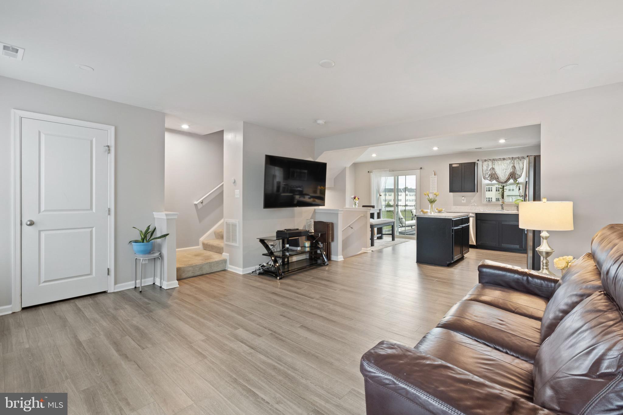 1049 Wickersham Way Middletown, DE 19709 - Photo 9 of 33 a living room with furniture and a flat screen tv