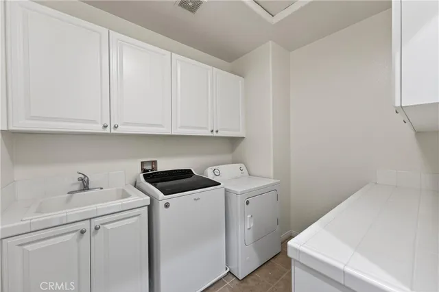 a view of storage and utility room with washer and dryer