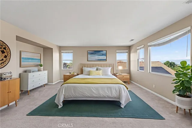 a living room with a bed furniture and a window