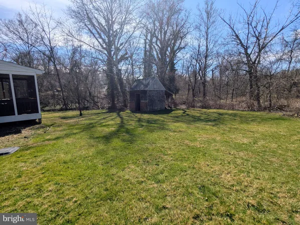 a view of a swimming pool with an outdoor space and seating area