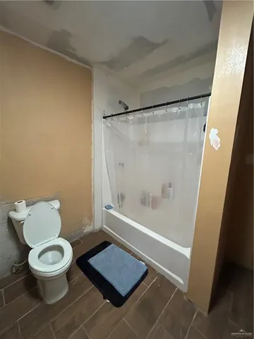 a white toilet sitting next to a bathroom sink
