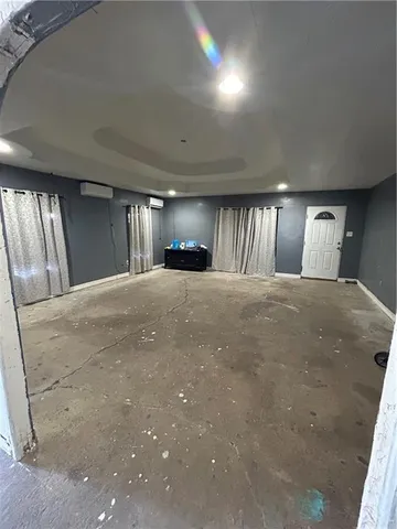 a large room with a large window and chandelier