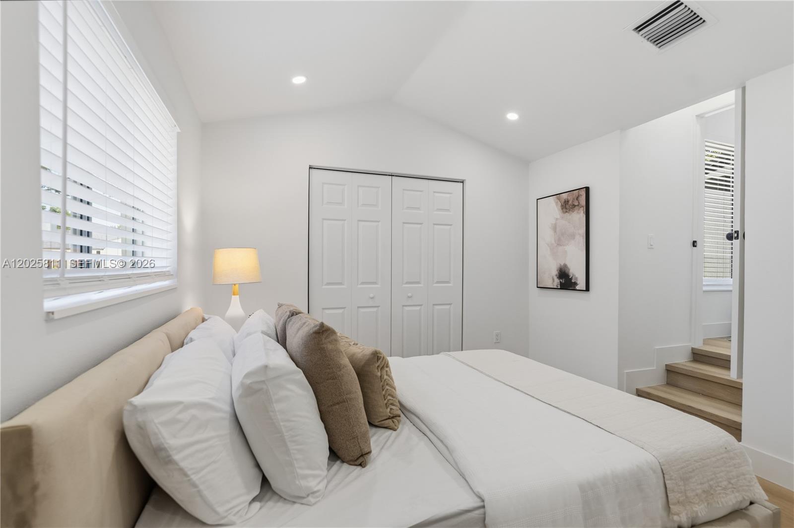 2110 Southwest 15th Street Miami, FL 33145 - Photo 26 of 37 a bedroom with a bed and a lamp