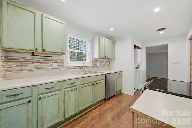 a kitchen with sink and cabinets
