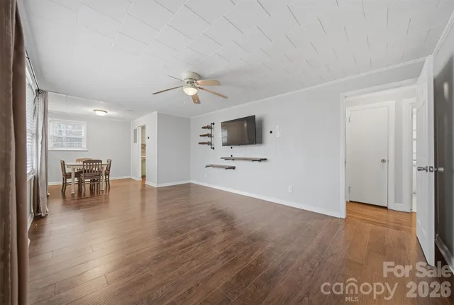a view of a livingroom with furniture and a workspace