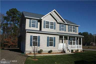 80 Bean Road Dowell, MD 20688 - Photo 1 of 6 a front view of a house with a yard