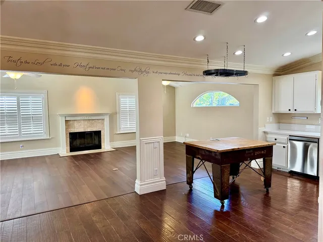 a view of kitchen with furniture and a fireplace