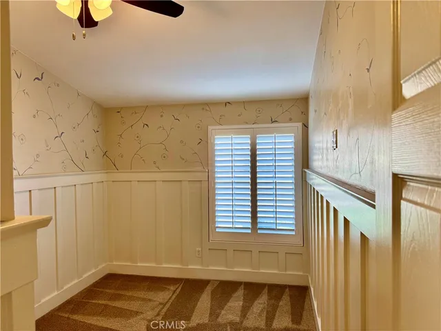 a view of hallway with windows