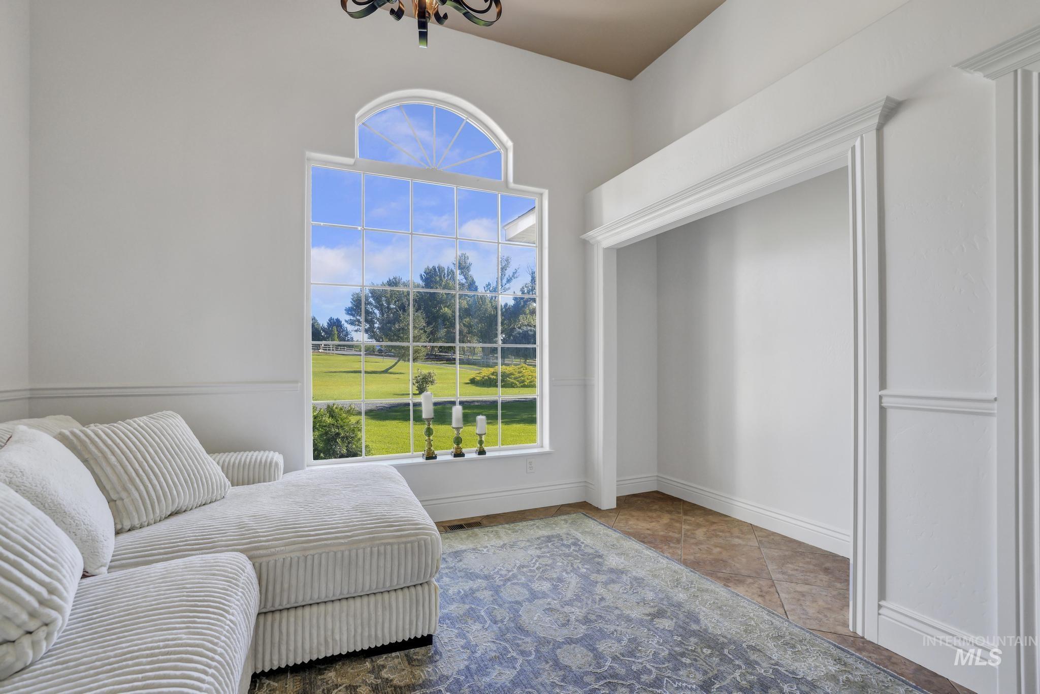 1301 Kanaka Rapids Road Buhl, ID 83316 - Photo 12 of 50 Grand arched window with grid detailing, offering expansive landscape views