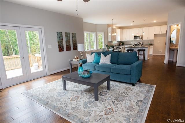 Lot 10 Corte Castle Road Chesterfield, VA 23838 - Photo 11 of 37 a living room with stainless steel appliances furniture wooden floor and a view of kitchen
