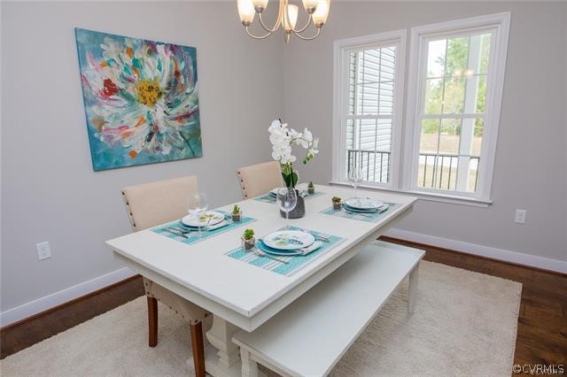 Lot 10 Corte Castle Road Chesterfield, VA 23838 - Photo 12 of 37 a view of a dining room with furniture a chandelier and wooden floor