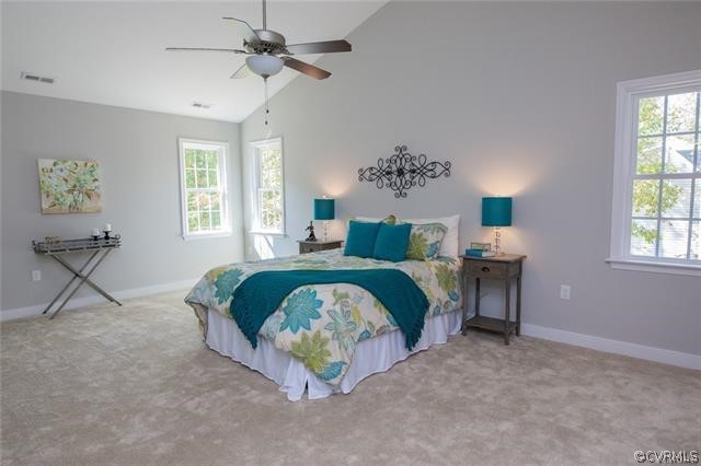 Lot 10 Corte Castle Road Chesterfield, VA 23838 - Photo 15 of 37 a bedroom with a bed and a chandelier
