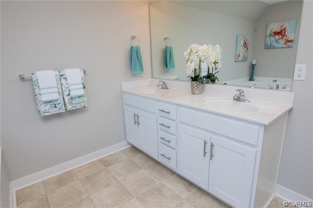 Lot 10 Corte Castle Road Chesterfield, VA 23838 - Photo 18 of 37 a bathroom with a double vanity sink and a mirror